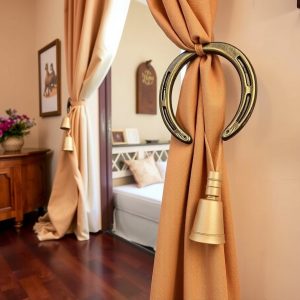 Use Horseshoes as Curtain Tiebacks