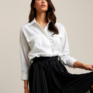 Classic White Shirt with a Black Pleated Skirt